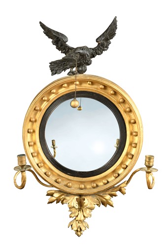 Lot 670 - A small Regency convex mirror