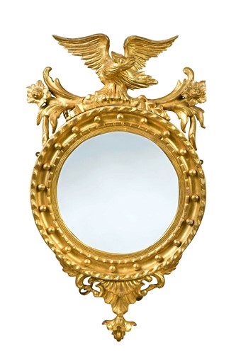 Lot 534 - A Regency giltwood convex wall mirror