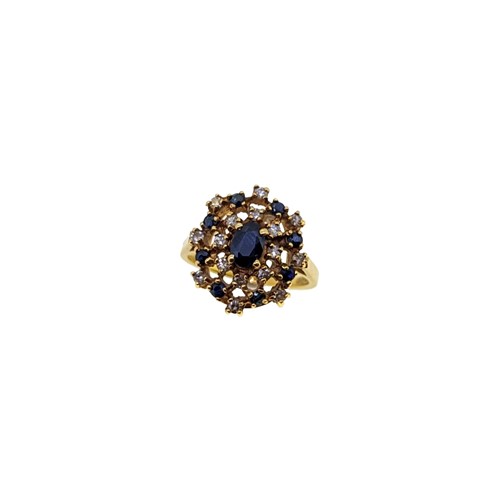 Lot 133 - A late 20th century 18ct gold sapphire and diamond cluster ring