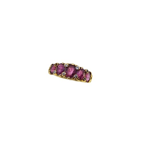 Lot 76 - A ruby and diamond carved half hoop style ring