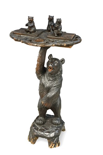 Lot 590 - A Black Forest carved wood smoker's companion