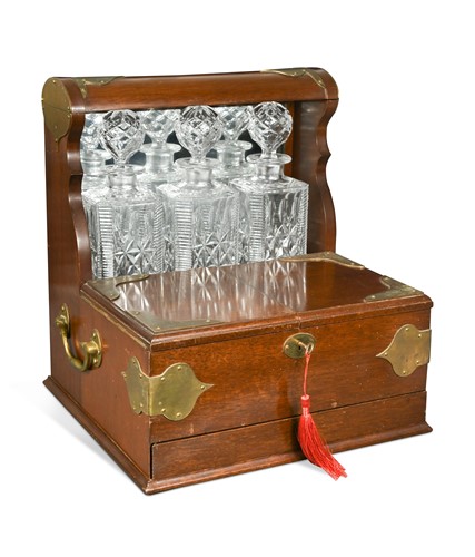 Lot 682 - A brass bound mahogany tantalus, 20th century