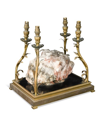 Lot 734 - A quartz mounted four branch table lamp
