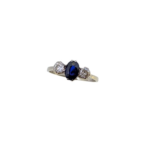 Lot 241 - A three stone sapphire and diamond ring