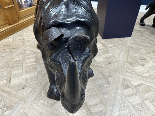 Lot 117 - A large scale leather covered rhino