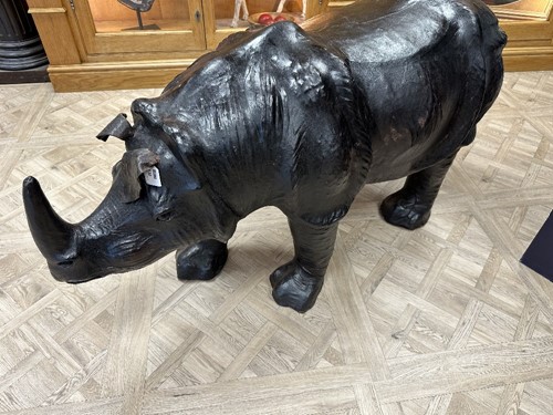 Lot 117 - A large scale leather covered rhino
