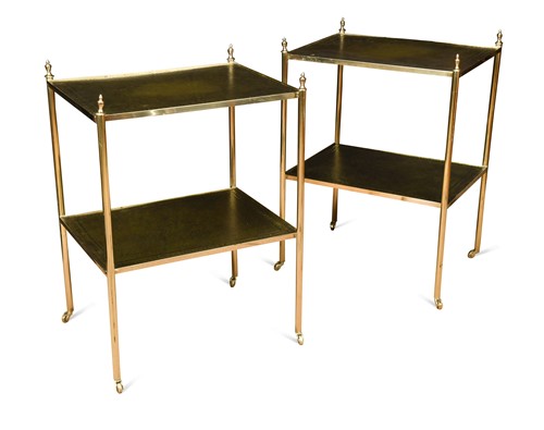 Lot 702 - A pair of leather topped brass etageres, 20th century