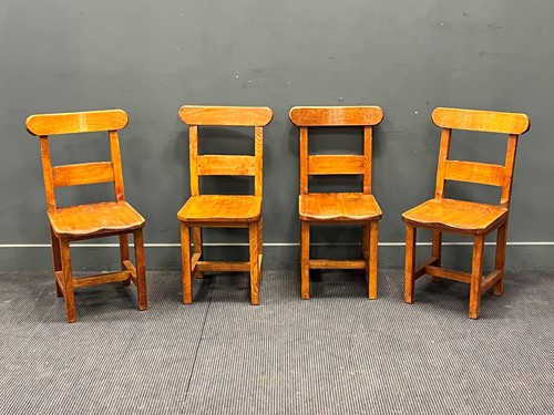 Lot 720 - A set of four 1930's oak chapel chairs