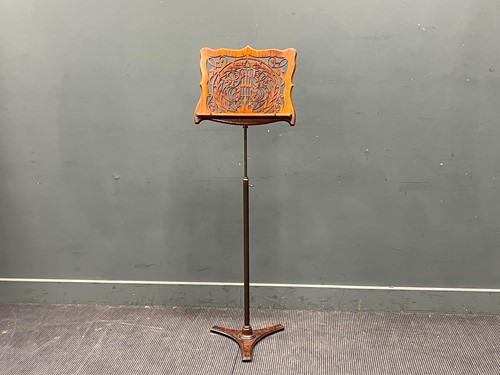 Lot 806 - An Edwardian adjustable brass and carved wood...
