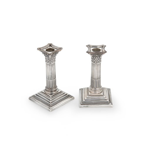 Lot 660 - A pair of Elizabeth II silver library candlesticks