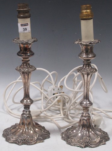 Lot 39 - A pair of silver plated candlestick lamps,...