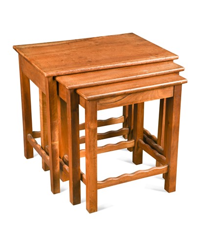 Lot 248 - Attributed to Gordon Russell, a nest of three walnut tables
