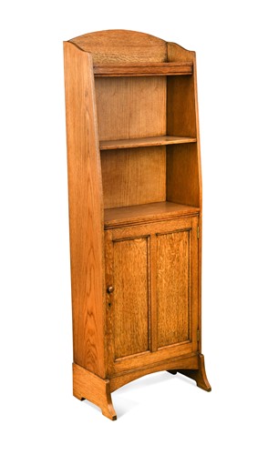 Lot 270 - An Arts & Crafts oak narrow bookcase cabinet, circa 1910