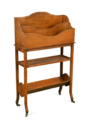 Lot 205 - An early 20th century oak book stand by Warings (Waring & Gillow), circa 1910