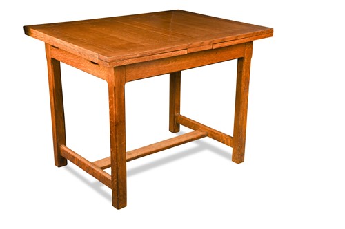 Lot 228 - A Heals oak draw-leaf dining table, circa 1925