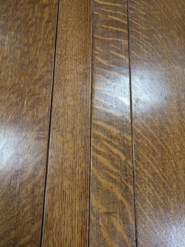 Lot 228 - A Heals oak draw-leaf dining table, circa 1925