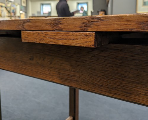 Lot 228 - A Heals oak draw-leaf dining table, circa 1925