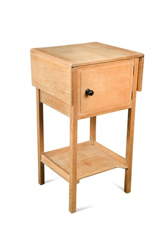 Lot 245 - A Heals limed oak drop leaf pot cupboard