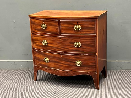 Lot 757 - A late Regency mahogany bow front chest of...