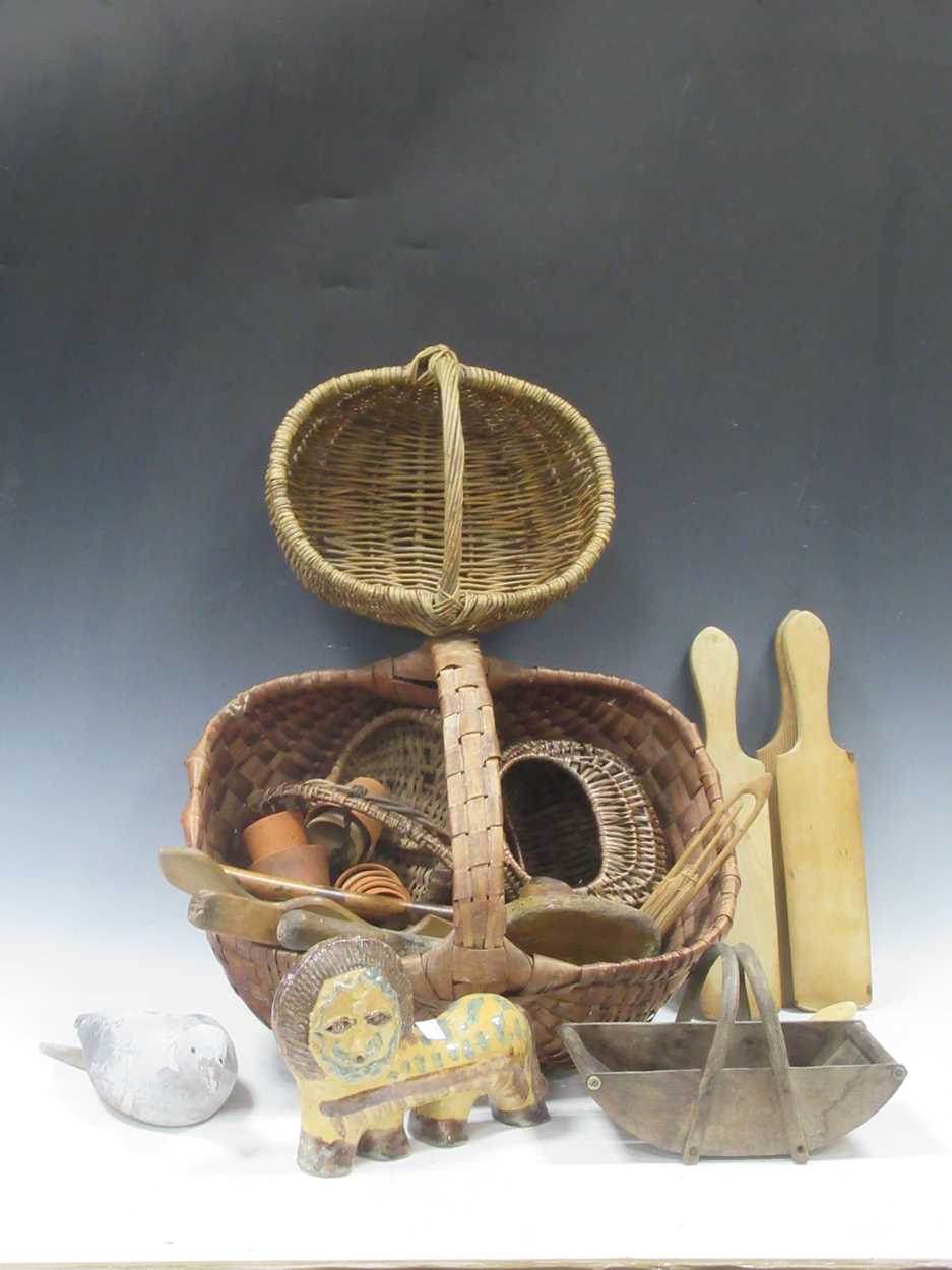 Lot 15 - A collection of baskets, antique butter pats,...