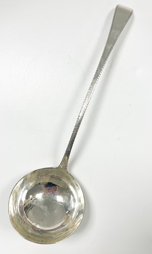 Lot 584 - A George III 18th century silver soup ladle