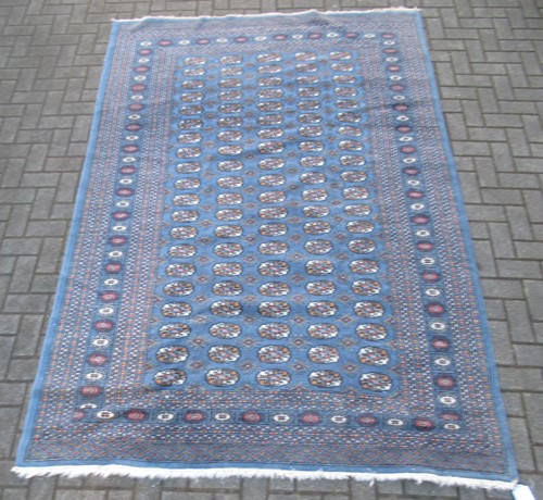 Lot 846 - A modern Teke type rug with slate blue ground...