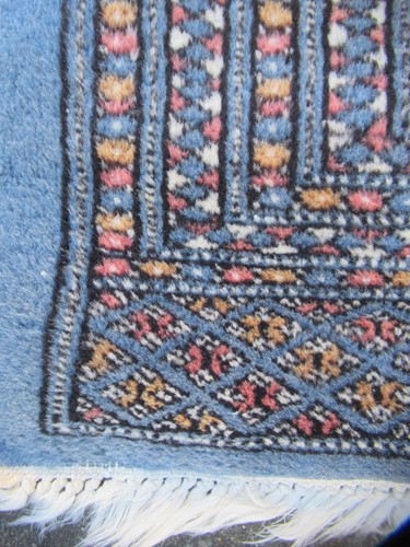 Lot 846 - A modern Teke type rug with slate blue ground...