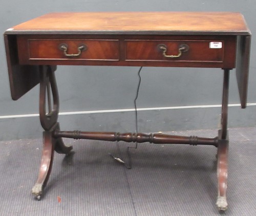 Lot 798 - A 20th century sofa table on lyre supports....