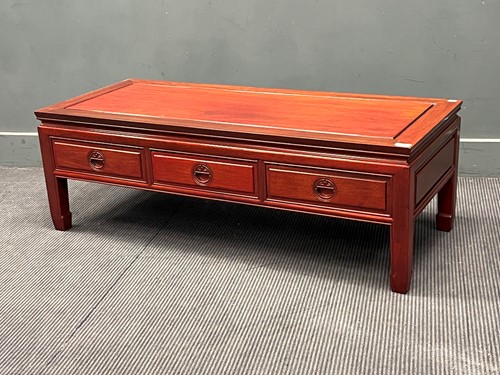 Lot 741 - A Chinese hardwood low coffee table with three...