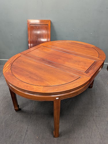 Lot 422 - A Chinese hardwood d-end extending dining...
