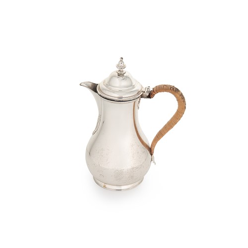 Lot 644 - A George V silver hot water jug