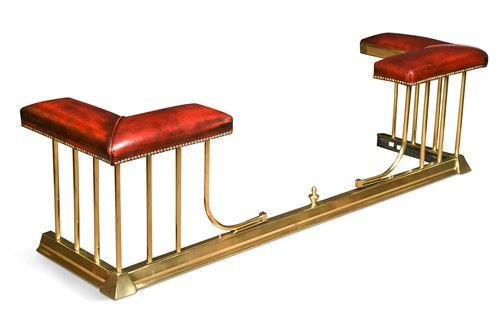 Lot 592 - A brass club fender, 20th century
