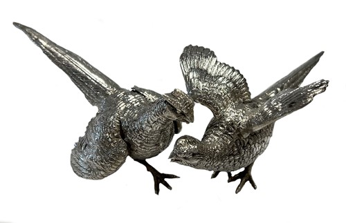 Lot 484 - A brace of 20th century German metalwares silver pheasants