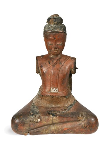 Lot 89 - A Burmese carved wood, red lacquered and shell inlaid seated Buddha fragment, 18th century