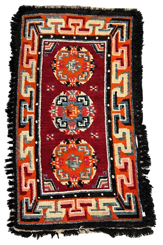 Lot 98 - A Tibetan saddle cloth, circa 1900-1920