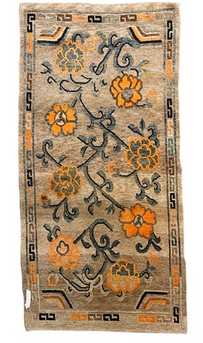 Lot 99 - A Tibetan wool rug, circa 1920/30