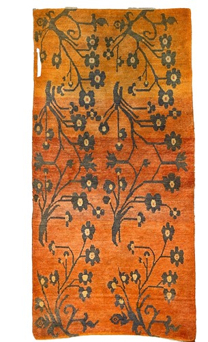 Lot 100 - A Tibetan wool orange ground rug, circa 1930