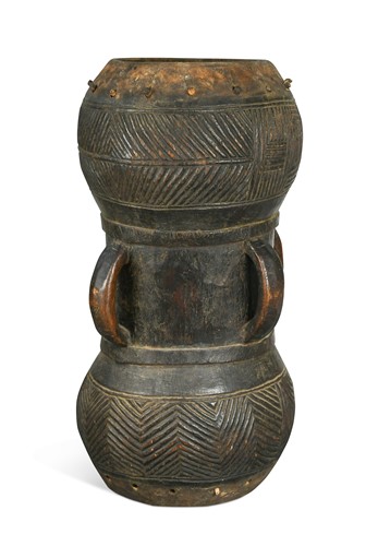 Lot 660 - A Kuba one piece carved wood ceremonial drum, Democratic Republic of Congo, 19th century