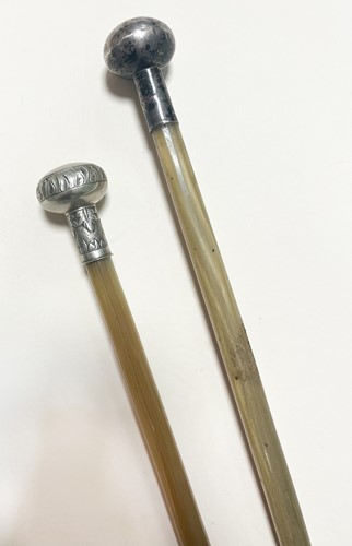 Lot 69 - Two White metal mounted horn riding crops, circa 1900