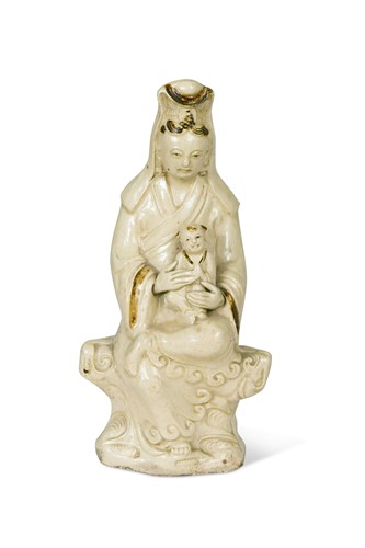 Lot 3 - A Chinese Cizhou figure of Guanyin with child, early 17th century