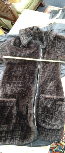 Lot 129 - A ladies' Prada coat and three other coats, a...