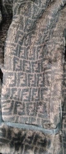 Lot 129 - A ladies' Prada coat and three other coats, a...