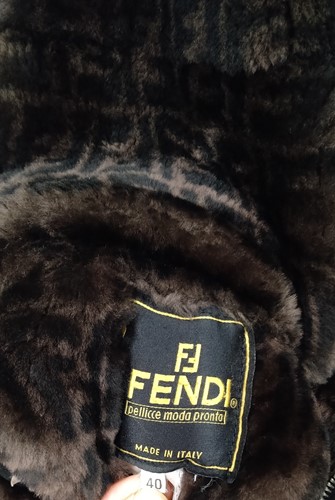 Lot 129 - A ladies' Prada coat and three other coats, a...