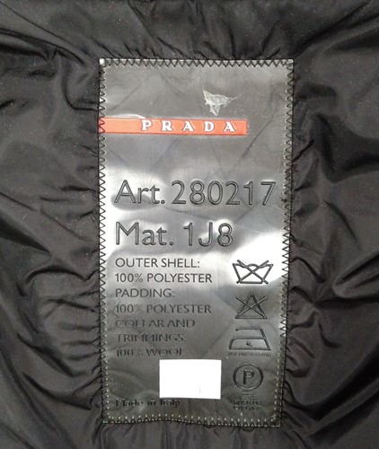 Lot 129 - A ladies' Prada coat and three other coats, a...