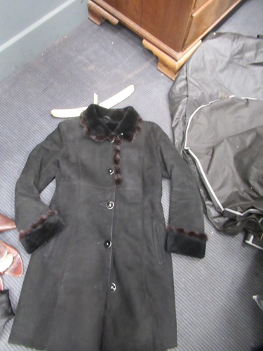 Lot 129 - A ladies' Prada coat and three other coats, a...