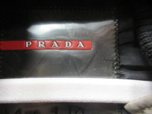 Lot 129 - A ladies' Prada coat and three other coats, a...