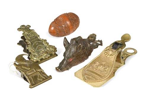 Lot 730 - A collection of three brass and one bronze letter clips