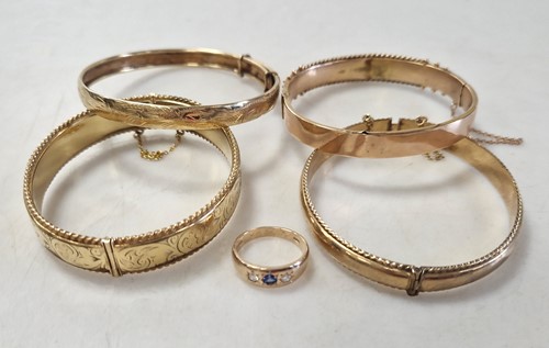 Lot 340 - Three 9ct gold bangles and a 9ct gold gem set...