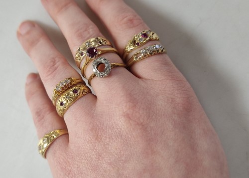 Lot 344 - A collection of seven 18ct gold gemset rings...