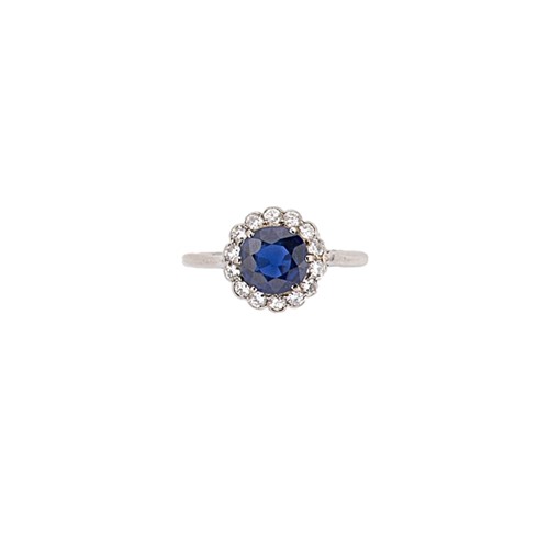 Lot 232 - A mid 20th century sapphire and diamond cluster ring